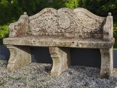 A carved limestone garden seat in 18th century style