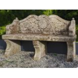 A carved limestone garden seat in 18th century style