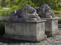 A pair of fine monumental sculpted limestone models of recumbent lions