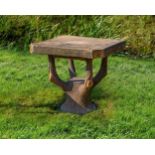 A stone composition faux bois garden table