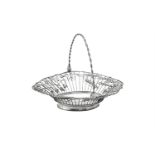 A late George II silver shaped oval swing handled bread basket by William Plummer
