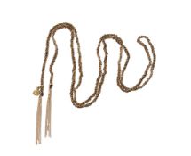 A woven gold coloured chain and silk thread necklace