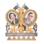 A silver gilt coloured and steel backed photo frame from Tehran City Council to Iskander Mizra