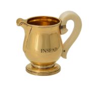 Y A French silver gilt baluster cream jug