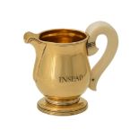 Y A French silver gilt baluster cream jug