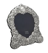 A silver mounted shaped photo frame by Carr's of Sheffield Ltd.