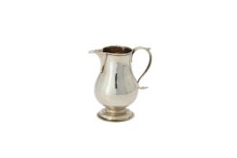 A George III silver baluster cream jug by George Greenhill Jones