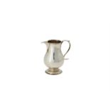 A George III silver baluster cream jug by George Greenhill Jones