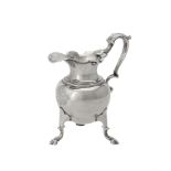 A George II silver cream jug by John Gorsuch