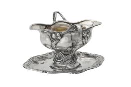 A German silver coloured shaped oval sauce boat on stand by Bruckmann & Sohne