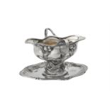 A German silver coloured shaped oval sauce boat on stand by Bruckmann & Sohne