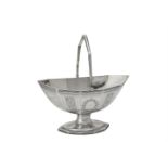 A George III silver shaped oval swing handled pedestal basket by Robert Hennell I & David Hennell II