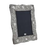 A silver mounted shaped rectangular photo frame by Ray Hall