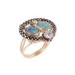 A diamond, opal and ruby snake dress ring