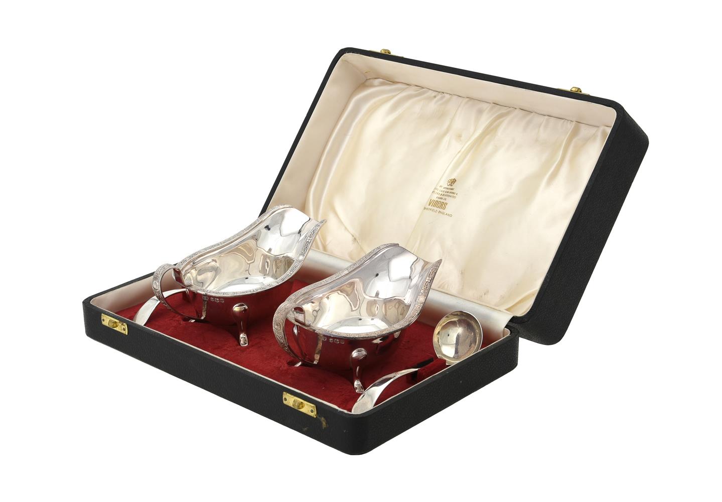 A cased pair of silver oval sauce boats and Old English pattern sauce ladles by Viner's Ltd.