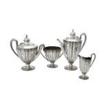 Y A Victorian silver shaped circular four piece tea set by Martin, Hall & Co.