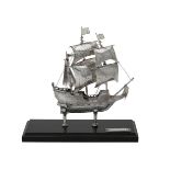 A silver coloured model of a galleon