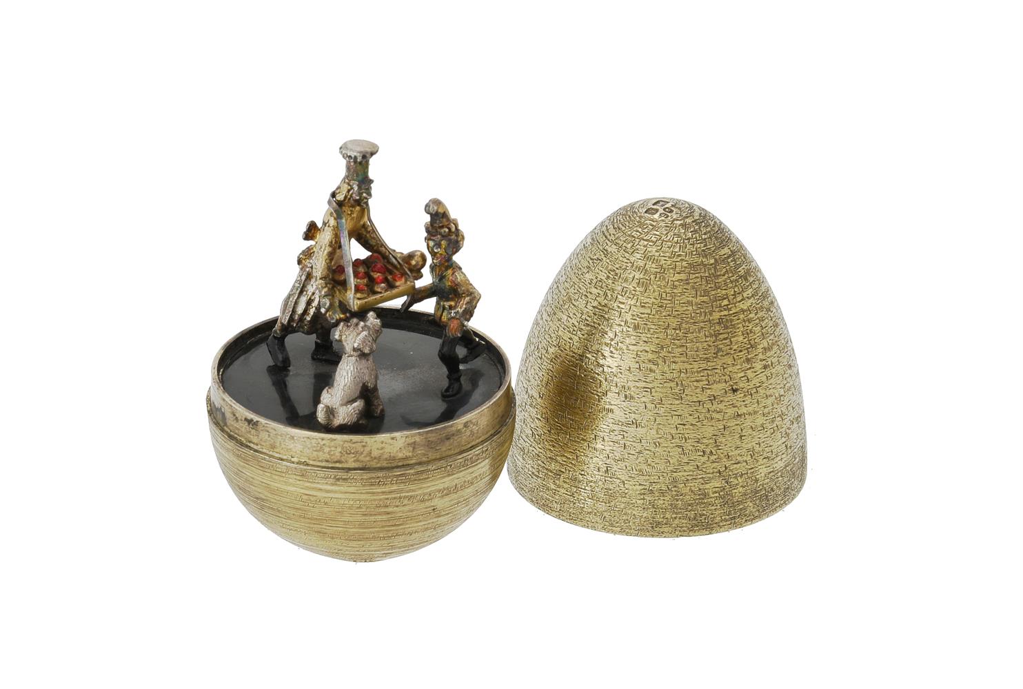 A silver gilt and enamel surprise egg by Stuart Devlin