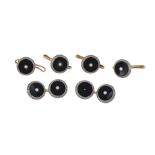 A pair of 1930s onyx and seed pearl cufflinks