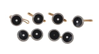 A pair of 1930s onyx and seed pearl cufflinks