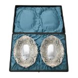 A cased pair of Victorian silver shaped oval dishes by Horton & Allday