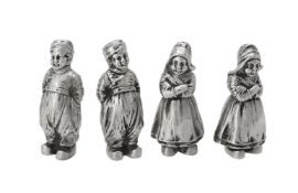 Two pairs of German silver figural pepperettes by B. Neresheimer & Sohne