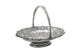 A late Victorian silver shaped oval swing handled basket by Josiah Williams & Co.
