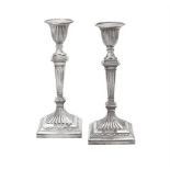 A pair of Victorian silver candlesticks by Hawksworth