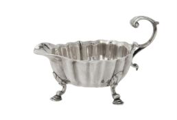 A George II silver lobed oval cream jug