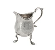 A George I silver pear shaped cream jug by John Eckford II