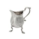 A George I silver pear shaped cream jug by John Eckford II