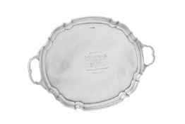 A silver twin handled shaped oval tray by James Deakin & Sons