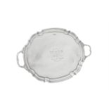 A silver twin handled shaped oval tray by James Deakin & Sons