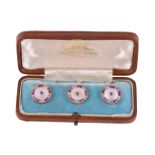 Y A set of three early 20th century ruby, diamond and mother of pearl buttons