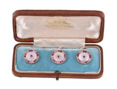 Y A set of three early 20th century ruby, diamond and mother of pearl buttons