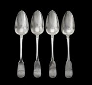 A set of four George III Irish silver fiddle pattern table spoons by Samuel Neville