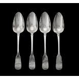 A set of four George III Irish silver fiddle pattern table spoons by Samuel Neville