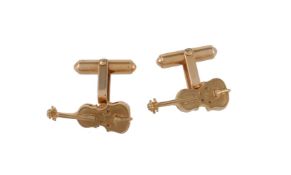 A pair of gold coloured violin cufflinks