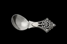 An Arts & Crafts silver tree of life pattern caddy spoon by Henry George Murphy