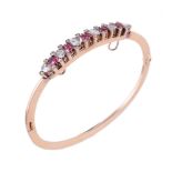 A late Victorian pink spinel and rose cut diamond hinged bangle