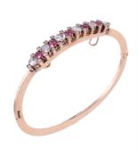 A late Victorian pink spinel and rose cut diamond hinged bangle