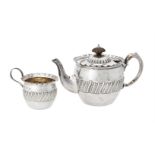 Y A Victorian silver circular tea pot and cream jug