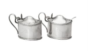 A pair of Victorian silver oval mustards by Daniel & John Wellby