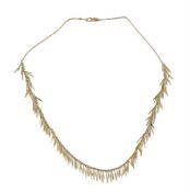 A gold Feather necklace by H. Stern