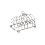 A George III silver six division toast rack by John & Henry Lias