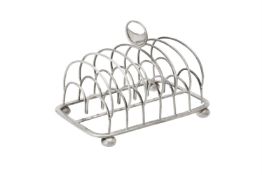 A George III silver six division toast rack by John & Henry Lias