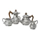 A silver matched circular baluster four piece tea set by Asprey & Co. Ltd.