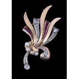 A 1940s Retro scrolled diamond and synthetic ruby flower head brooch