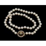 A cultured pearl necklace with amethyst clasp
