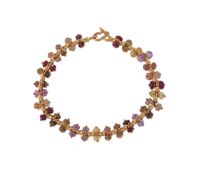 A gold coloured beaded bracelet